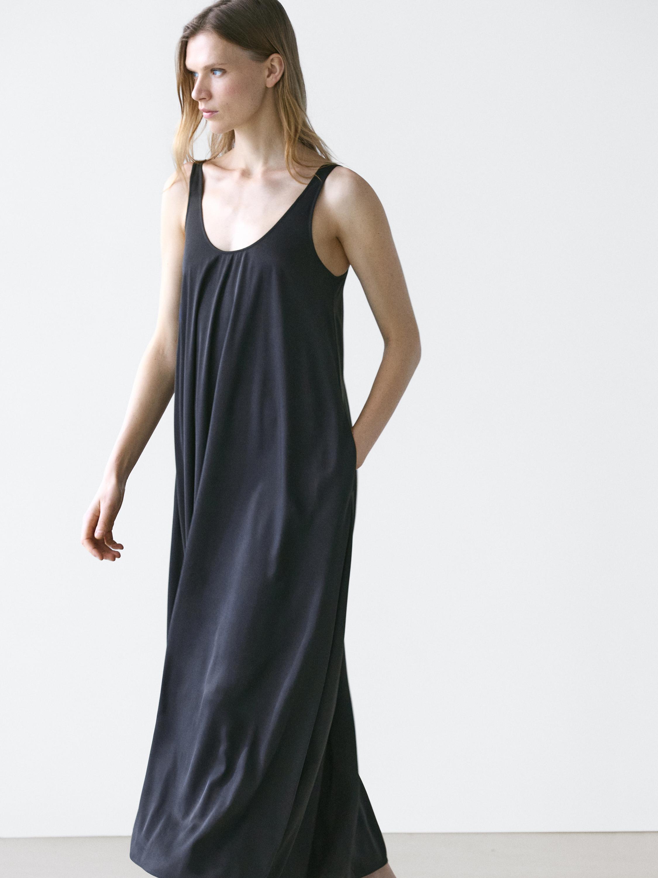 Flowing flared dress with straps